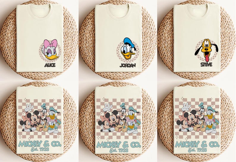 May include: Six white t-shirts with different cartoon character designs. The shirts feature Mickey Mouse, Donald Duck, Goofy, and Minnie Mouse. The shirts have a checkered pattern and the text "Mickey & Co. Est. 1928".