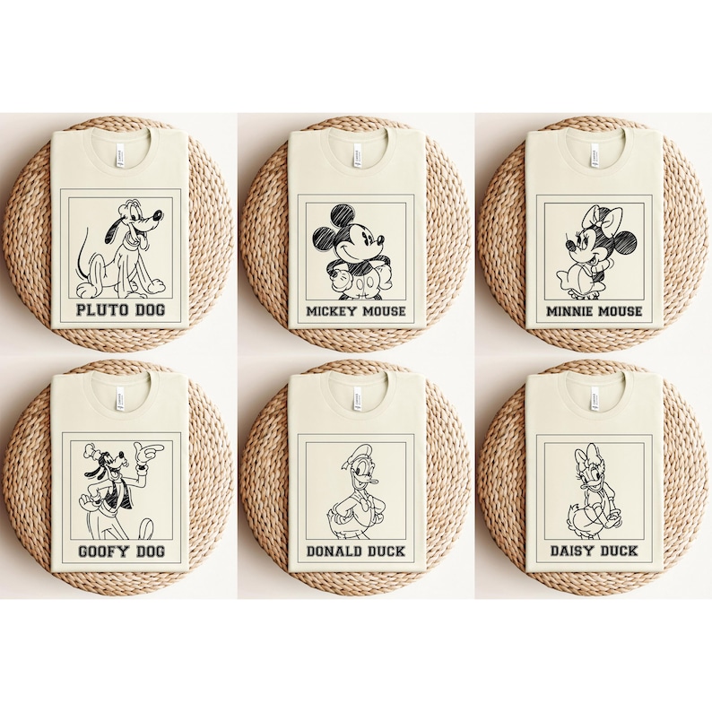May include: Six cream-colored t-shirts featuring black line drawings of Disney characters: Pluto Dog, Mickey Mouse, Minnie Mouse, Goofy Dog, Donald Duck, and Daisy Duck. Each design is framed with a black border and character name.