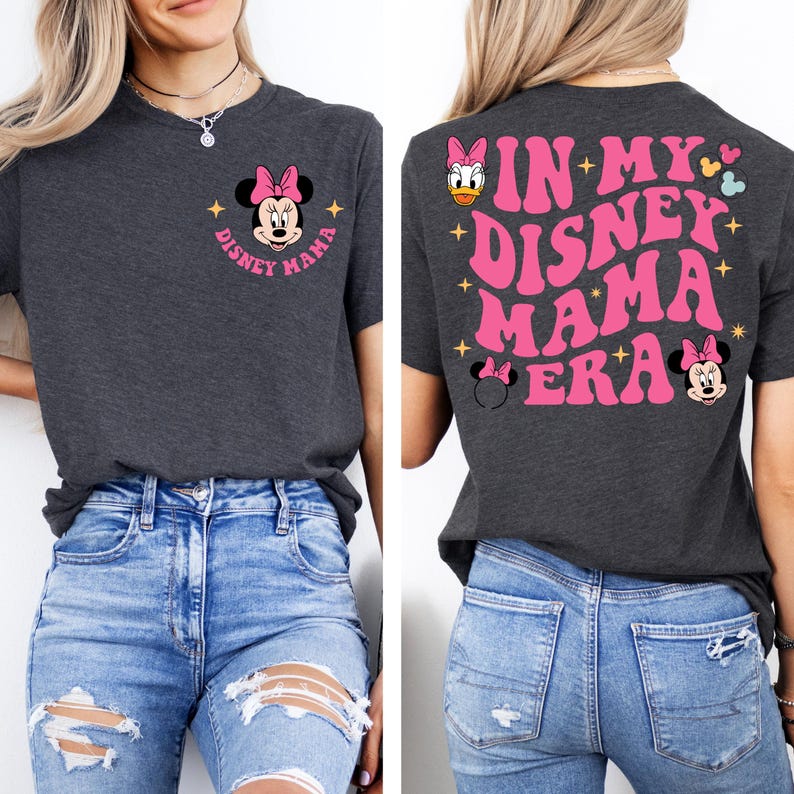 May include: A dark grey t-shirt with a pink Minnie Mouse graphic on the front and the text "Disney Mama" in pink. The back of the shirt has the text "In My Disney Mama Era" in pink with a pink Minnie Mouse graphic and a pink Daisy Duck graphic.