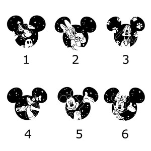 May include: Six black and white character designs in the shape of Mickey Mouse's head. Each design features a different character, including Mickey, Donald, Goofy, and Minnie, set against a starry night sky background.