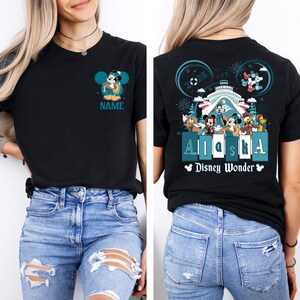 May include: Black t-shirt with a Mickey Mouse graphic on the front and a Disney Wonder cruise ship graphic on the back. The back graphic includes the text "Alaska" and "Disney Wonder".