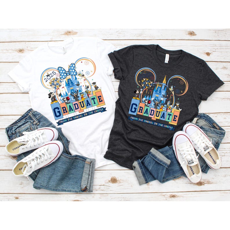 May include: Two t-shirts with a graduation theme featuring Mickey Mouse and friends at Disney World. The white t-shirt has the year 2025 printed on it. Both shirts have the text "Graduate from the tassel to the castle".
