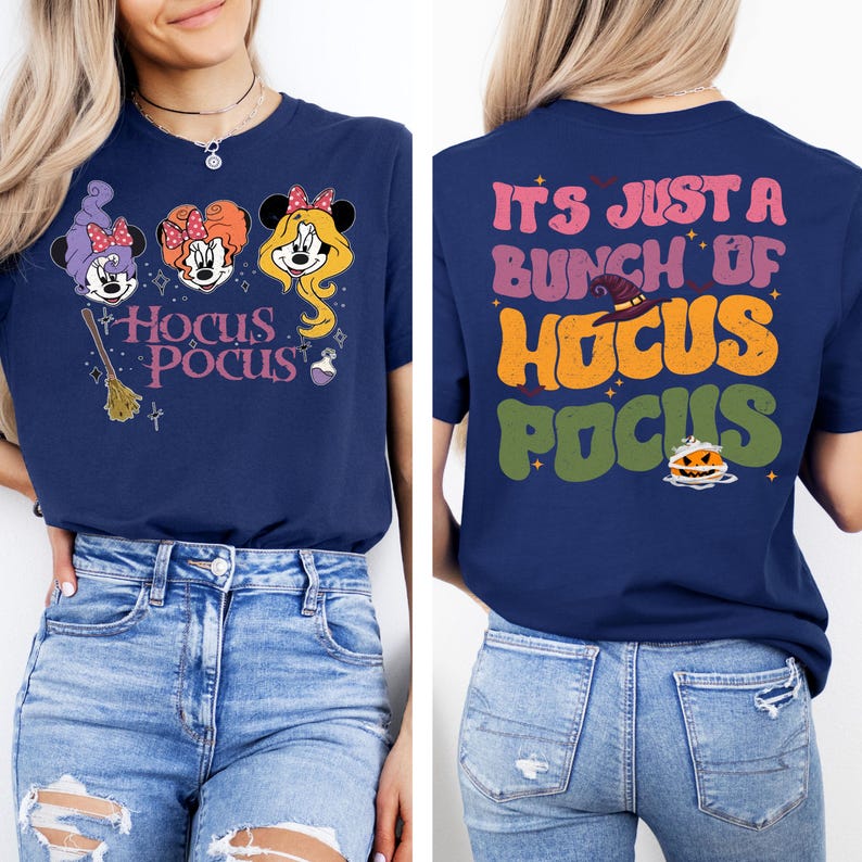 May include: A navy blue t-shirt with a graphic of three witches with the text "Hocus Pocus" on the front. The back of the shirt has the text "It's just a bunch of Hocus Pocus" in a retro font.