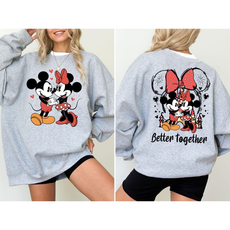 May include: Gray sweatshirt with a graphic of Mickey Mouse and Minnie Mouse holding hands. The back of the sweatshirt has a graphic of Mickey Mouse and Minnie Mouse with a red bow and the text "Better Together".