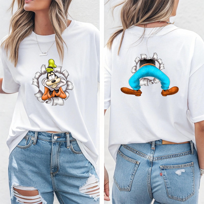 K&ouml;nnte beinhalten: Wei&szlig;es T-Shirt mit einem Cartoon-Charakter-Design. Die Vorderseite zeigt das Gesicht der Figur, das aus einem zerrissenen Loch kommt, und die R&uuml;ckseite zeigt die Beine und F&uuml;&szlig;e der Figur. Das Design enth&auml;lt orange, gelbe und blaue Akzente.