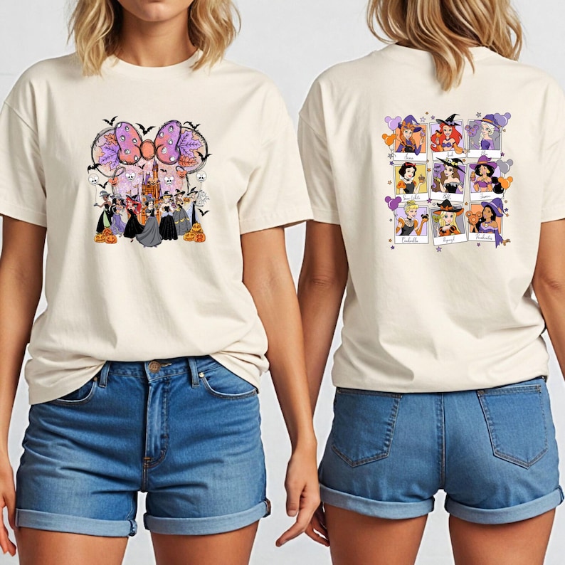 May include: Cream-colored t-shirt featuring a Halloween-themed graphic on the front and back. The front design includes a large bow, castle, and characters. The back displays nine witch-themed portraits. The shirt is paired with blue denim shorts.