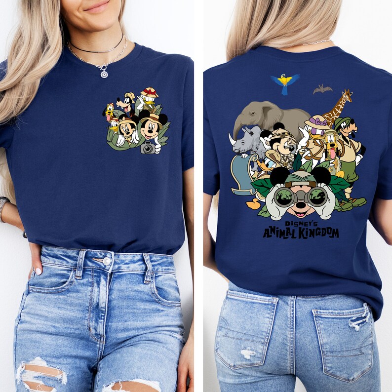 May include: A navy blue t-shirt with a graphic of Mickey Mouse and friends in a jungle setting. The back of the shirt has a larger graphic of Mickey Mouse and friends with the text "Disney's Animal Kingdom".