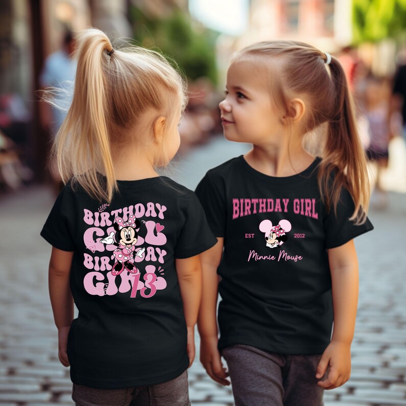 May include: Two children wearing black t-shirts with pink birthday girl designs featuring Minnie Mouse. One shirt says "Birthday Girl" with Minnie Mouse and "Est. 2012 Minnie Mouse". The other shirt says "Birthday Girl Birthday Girl 13" with Minnie Mouse.