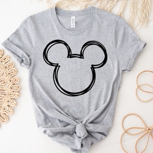 May include: A gray t-shirt with a black outline of Mickey Mouse's head.