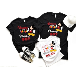May include: Three black t-shirts with a Mickey Mouse design. The shirts say "Mommy of the Birthday Boy", "Daddy of the Birthday Boy", and "It's My 2nd Birthday Noah".