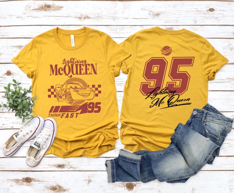 May include: Two yellow t-shirts with a Cars theme. One shirt features Lightning McQueen with the text "Lightning McQueen", "Think Fast", and "95". The other shirt has the number "95" and the text "Lightning McQueen".