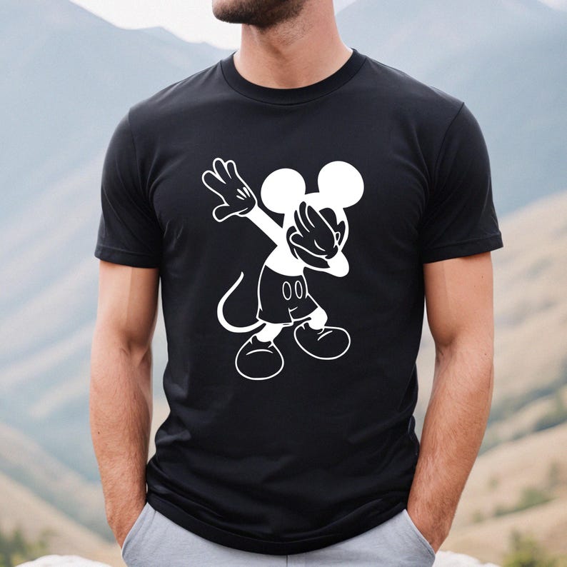 May include: Black t-shirt with a white graphic of Mickey Mouse doing the dab.