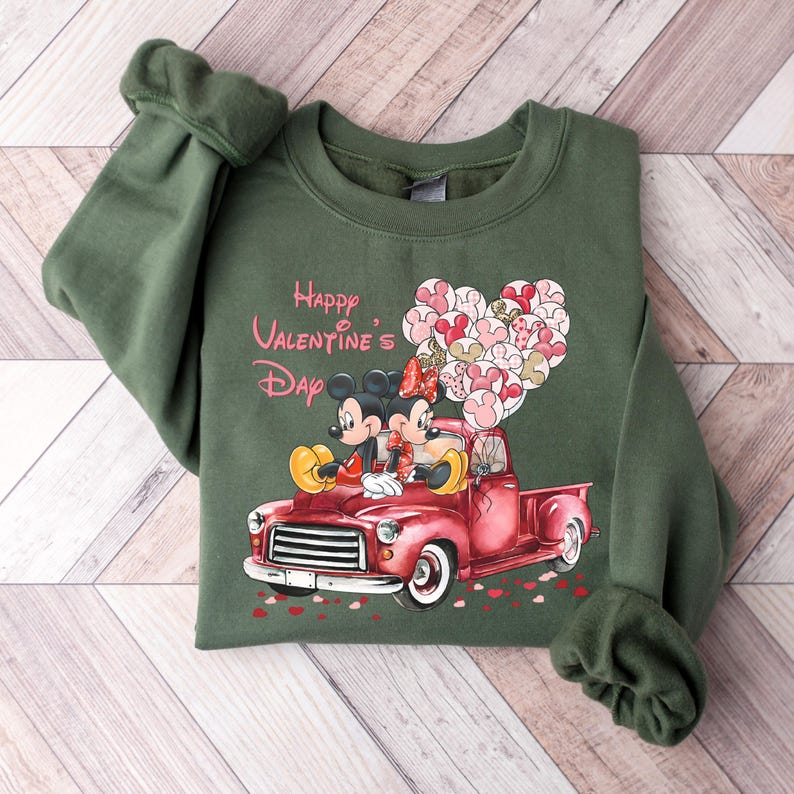 May include: Green sweatshirt with a red truck, Mickey Mouse and Minnie Mouse, and the text "Happy Valentine's Day".