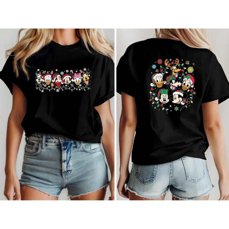 May include: Black t-shirt featuring a festive design with Disney characters wearing Santa hats and surrounded by Christmas lights. The front design includes Donald Duck, Daisy Duck, Mickey Mouse, Minnie Mouse, and Goofy. The back design features Mickey, Minnie, Donald, Goofy, and Pluto.