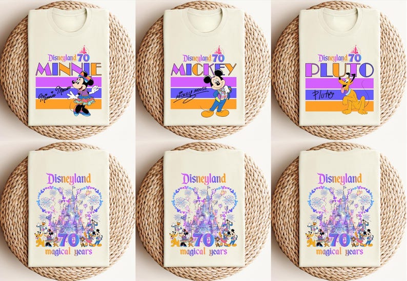 May include: Six different t-shirt designs featuring various Disney characters celebrating Disneyland's 70th anniversary. The designs include Mickey Mouse, Minnie Mouse, Pluto, and a castle with fireworks.