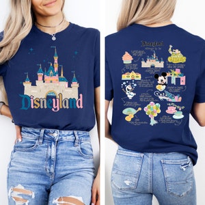 May include: A navy blue t-shirt with a graphic of the Disneyland castle on the front and a graphic of Disneyland attractions on the back. The text "Disneyland" is printed on the front of the shirt.