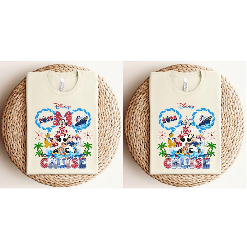 May include: Two cream-colored t-shirts with a Disney Cruise design. The design features Mickey and Minnie Mouse, a cruise ship, and the text "Cruise 2025". The shirts are displayed on a woven, circular placemat.