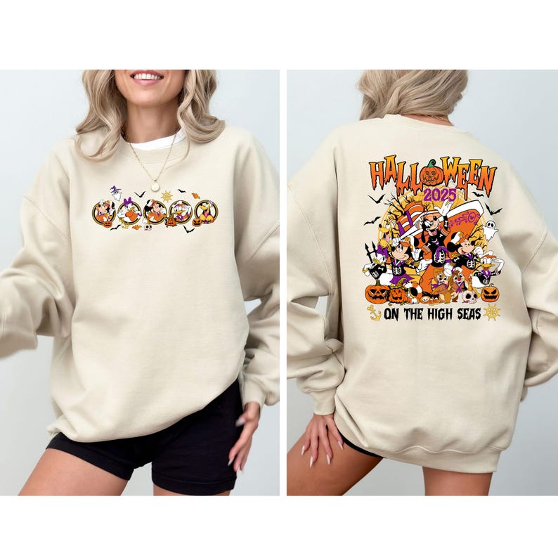 May include: A beige sweatshirt with a Halloween-themed graphic. The front features cartoon characters in circular frames, and the back displays "Halloween 2025" with pumpkins and characters, and the text "On The High Seas".