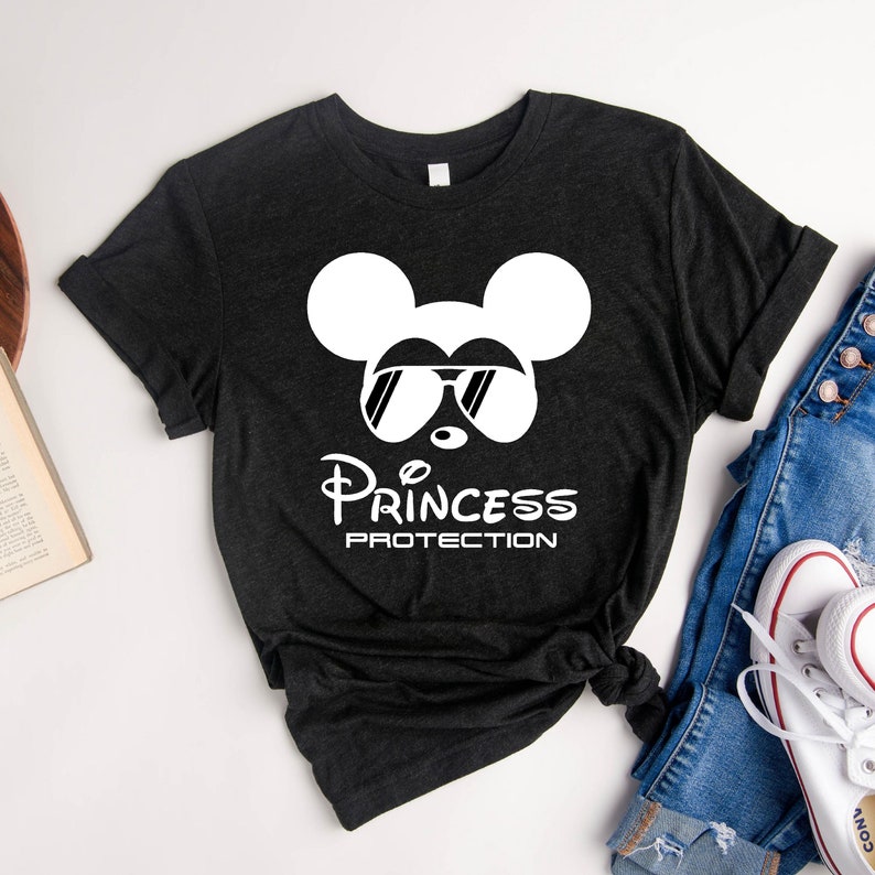 May include: Black t-shirt with a white Mickey Mouse wearing sunglasses and the text "Princess Protection" underneath.