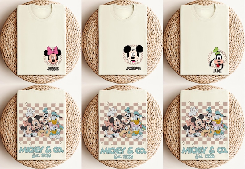 May include: Six white t-shirts with different Disney character designs. The shirts feature Mickey Mouse, Minnie Mouse, Donald Duck, Goofy, and Pluto. The shirts have a checkered pattern and the text "Mickey & Co. Est. 1928".
