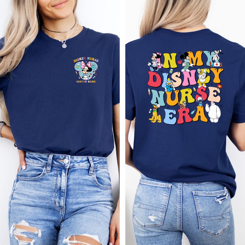 May include: Navy blue t-shirt with a colorful Disney Nurse design on the front and back. The front features Minnie Mouse and the text "Disney Nurse" and "Custom Name". The back says "In My Disney Nurse Era" with Disney characters.