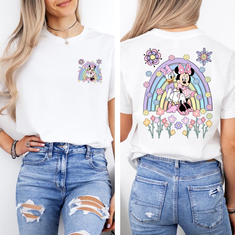 May include: White t-shirt with a rainbow and Minnie Mouse and Daisy Duck graphic on the back. The front of the shirt has a smaller version of the graphic on the left side of the chest.