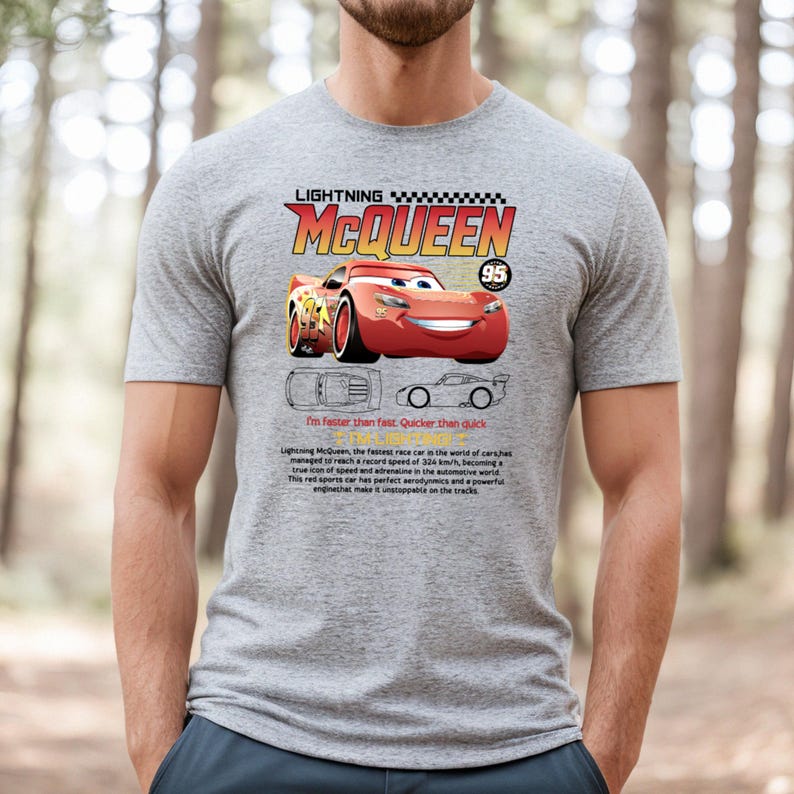May include: A gray t-shirt featuring Lightning McQueen, a red race car from the Cars movie. The shirt includes the text "LIGHTNING MCQUEEN" and "95", along with the phrase "I'm faster than fast. Quicker than quick."