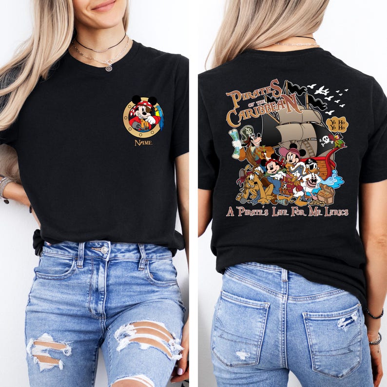 May include: Black t-shirt with a Mickey Mouse character wearing a pirate hat and holding a treasure chest. The back of the shirt has a graphic of Mickey Mouse and other Disney characters dressed as pirates with the text "Pirates of the Caribbean" and "A Pirate's Life For Me, Lads".