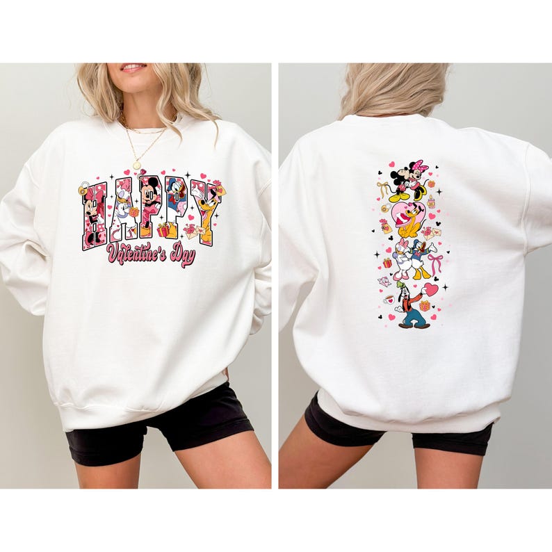 May include: White sweatshirt featuring a colorful graphic with Disney characters and the text "Happy Valentine's Day." The front design includes Mickey and Minnie Mouse, Donald Duck, and other characters. The back has a vertical design with more characters.