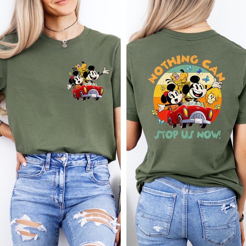 May include: A green t-shirt with a vintage-style graphic of Mickey Mouse, Minnie Mouse, and Pluto driving a red car. The text "Nothing Can Stop Us Now!" is printed on the back of the shirt.