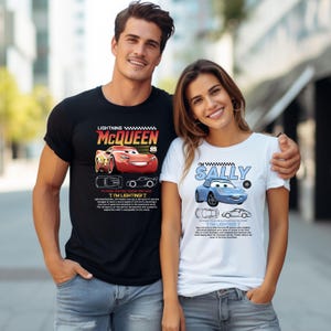 May include: A black t-shirt with a Lightning McQueen graphic and a white t-shirt with a Sally graphic. Both shirts feature cartoon car designs and text. The people are wearing blue jeans.