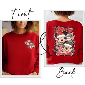 May include: Red sweatshirt with a Christmas-themed design. The front features a candy cane and Mickey Mouse head design. The back displays Mickey and Minnie Mouse wearing Santa hats, surrounded by candy canes, with the words "Merry Christmas".
