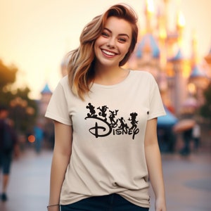 May include: A white t-shirt with a black graphic of Mickey Mouse and other Disney characters. The graphic includes the word "DISNEY" in a stylized font.