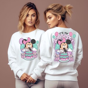 May include: White sweatshirt with a graphic of Minnie Mouse holding a birthday cake and the text "it's my birthday".