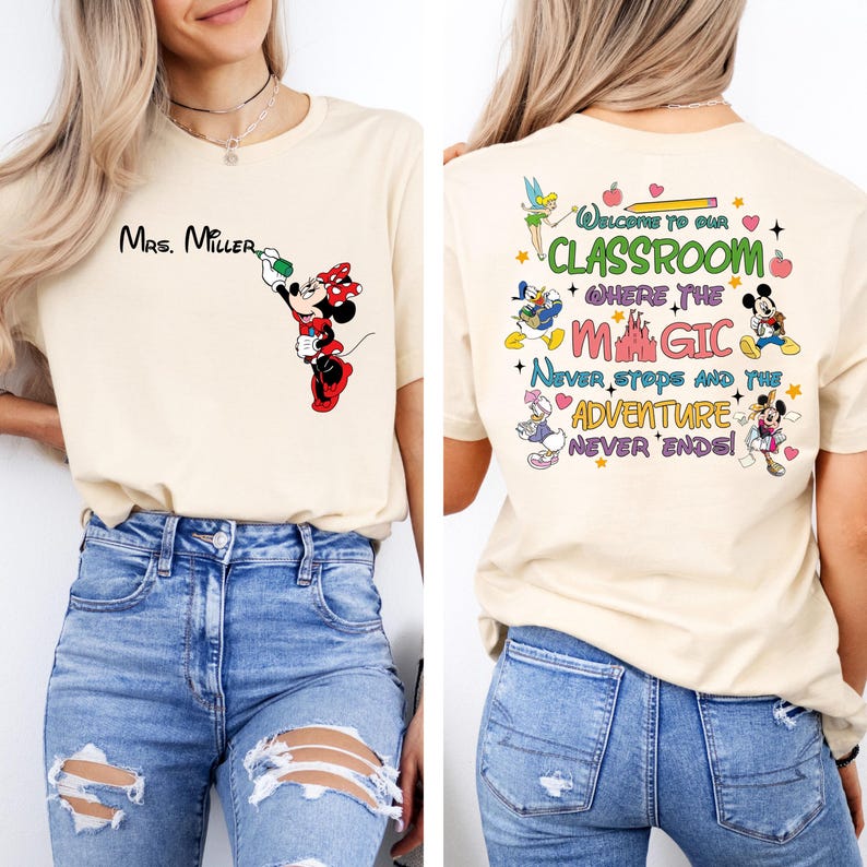 May include: A light beige t-shirt with a Mickey Mouse and Minnie Mouse design on the front and a Disney-themed classroom quote on the back. The quote reads "Welcome to our classroom where the magic never stops and the adventure never ends!"
