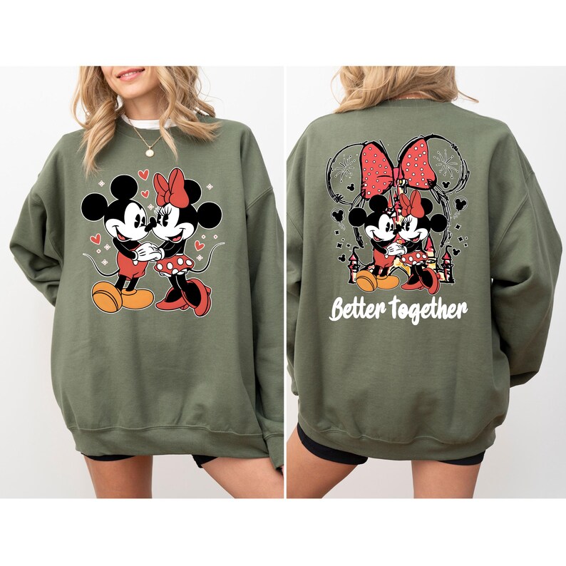 May include: Green sweatshirt with a graphic of Mickey Mouse and Minnie Mouse holding hands. The back of the sweatshirt has a graphic of Mickey and Minnie Mouse hugging with the text "Better Together".