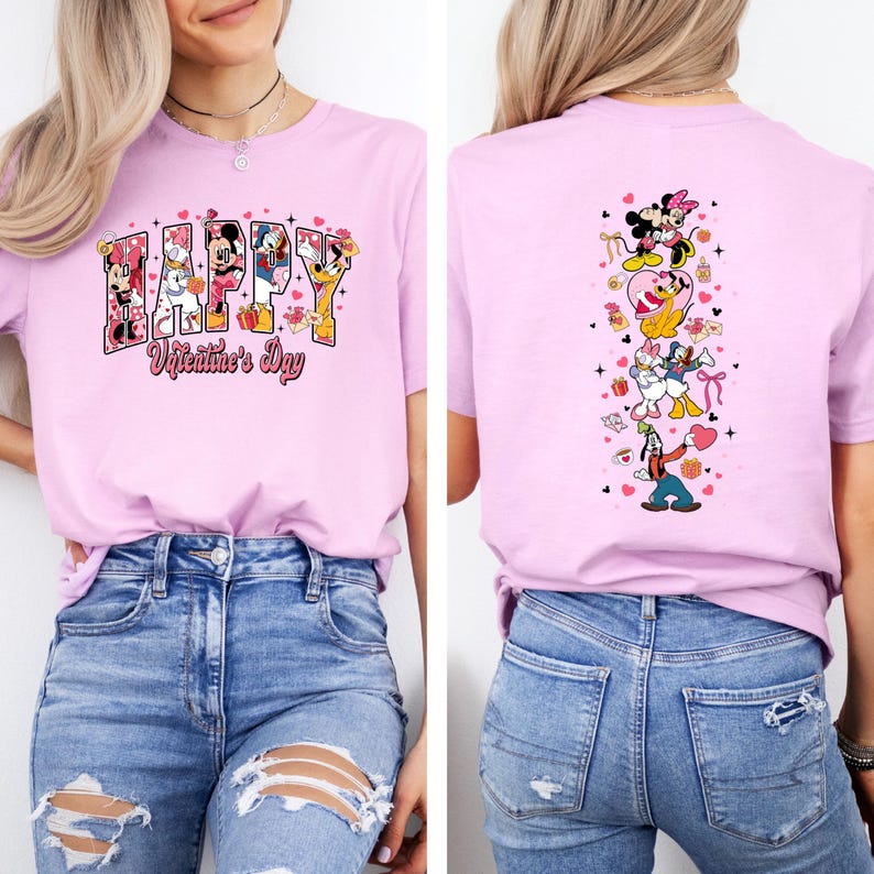May include: A light pink t-shirt featuring the text "HAPPY Valentine's Day" with Disney characters. The back of the shirt has a vertical design of Disney characters. The shirt is paired with blue jeans.