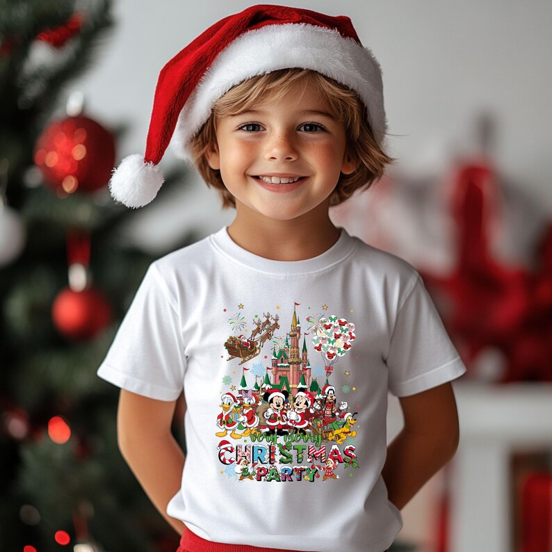 May include: A child wearing a white t-shirt and a red Santa hat. The shirt features a colorful graphic of Disney characters celebrating Christmas with the text "Christmas Party".