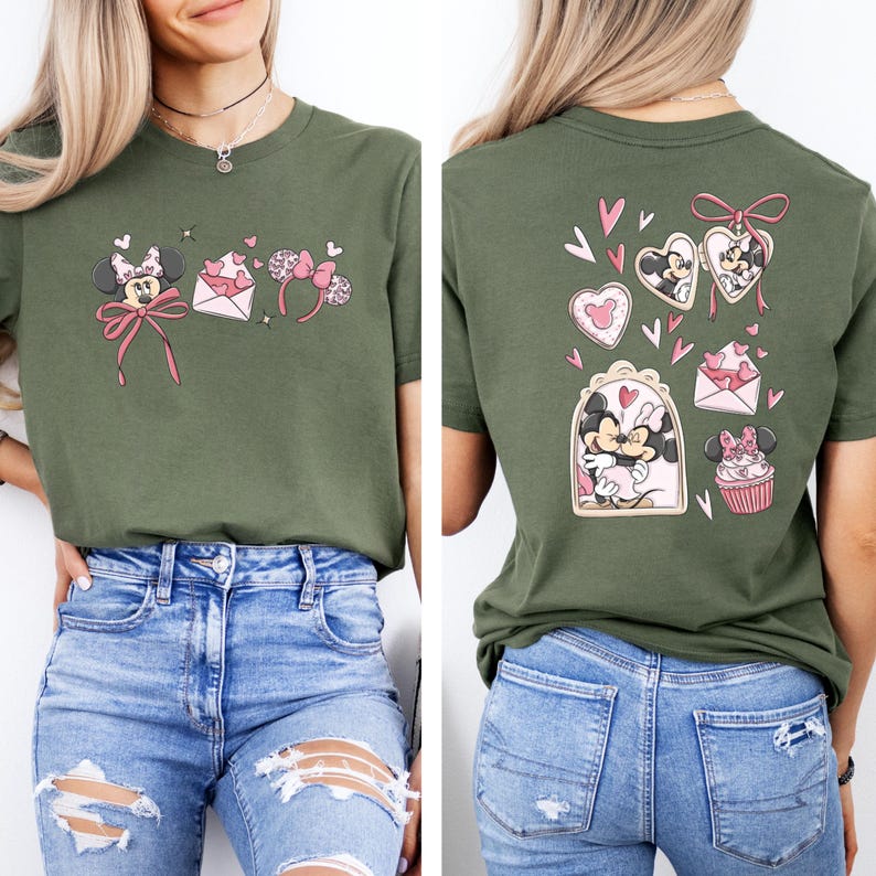 May include: Olive green t-shirt featuring Minnie Mouse-themed graphics on the front and back. The front design includes a bow, ears, and an envelope with hearts. The back design showcases Minnie and Mickey Mouse in heart-shaped frames and a cupcake.