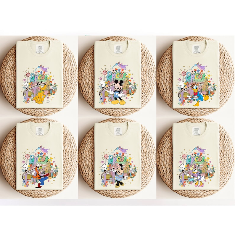 May include: Six cream-colored t-shirts with different Disney characters and the word "Epcot" printed on them. Each shirt features a different character from Mickey Mouse, Minnie Mouse, Donald Duck, Goofy, Pluto, and a purple dragon.