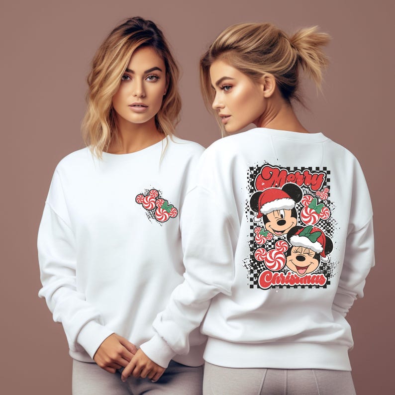 May include: White sweatshirt featuring a Mickey Mouse and Minnie Mouse Christmas design. The front has a small candy cane graphic, while the back displays a larger graphic with the words "Merry Christmas".
