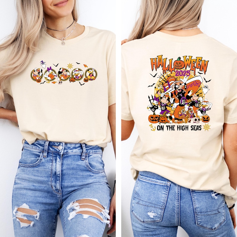 May include: Beige t-shirt featuring a Halloween-themed graphic. The front displays cartoon characters in Halloween costumes. The back of the shirt has the text "Halloween 2025" with a group of cartoon characters and the phrase "On the High Seas".