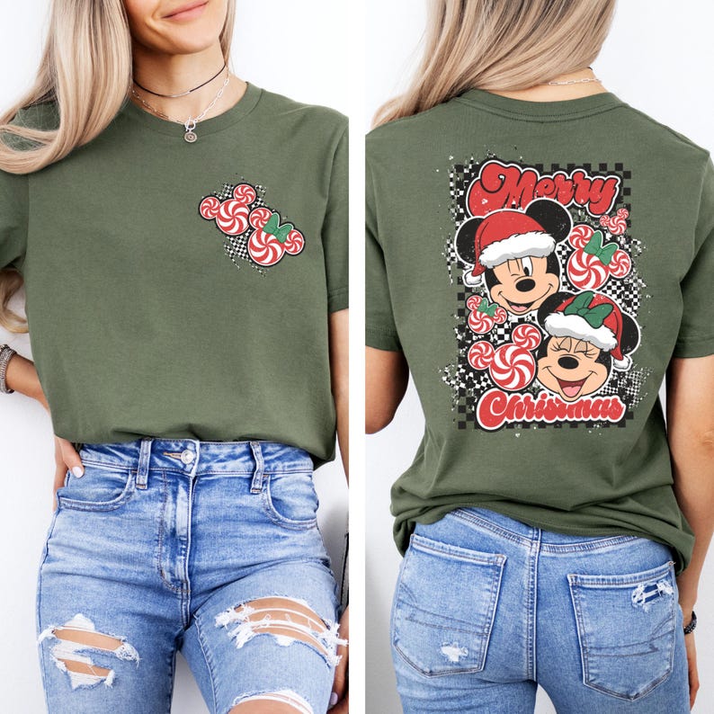 May include: Olive green t-shirt featuring a Christmas design. The front has a candy cane Mickey Mouse design. The back has Mickey and Minnie Mouse wearing Santa hats with the words "Merry Christmas" and "Christmas".