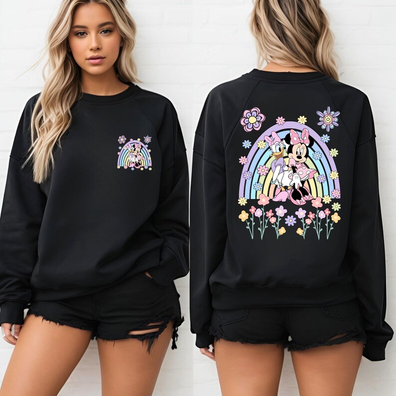 May include: Black sweatshirt with a rainbow and Minnie Mouse and Daisy Duck graphic on the back. The front of the sweatshirt has a smaller version of the graphic on the left chest.