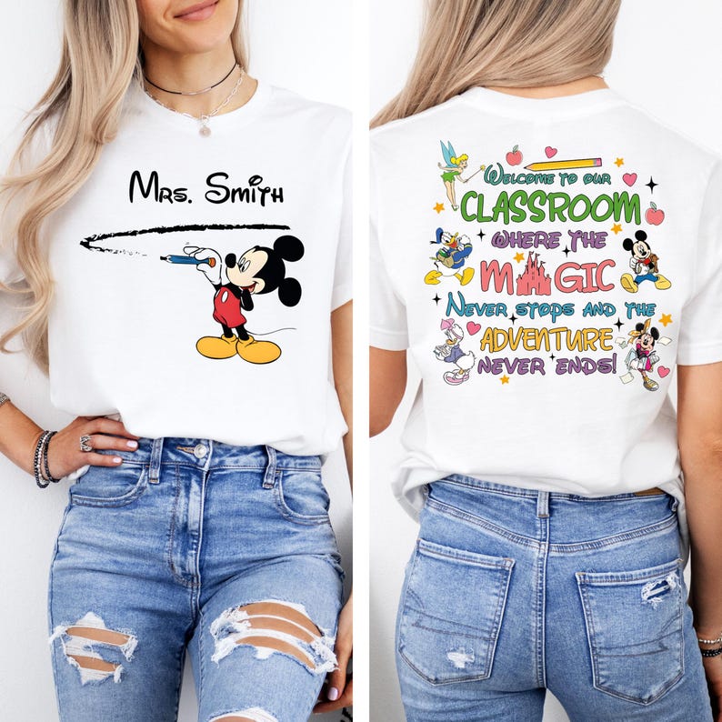 May include: White t-shirt with a black and red Mickey Mouse illustration holding a pencil and the text "Mrs. Smith" above him. The back of the shirt has a colorful design with the text "Welcome to our Classroom where the Magic Never Stops and the Adventure Never Ends!"