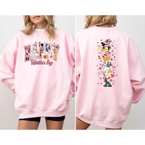 May include: A light pink sweatshirt featuring the words "Happy Valentine's Day" with Disney characters. The back of the sweatshirt has a vertical design with more Disney characters and hearts.