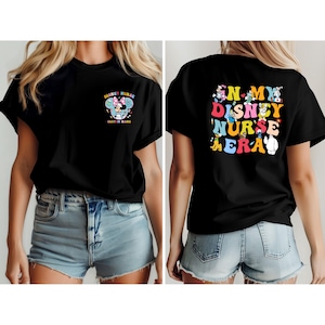 May include: Black t-shirt with the text "Disney Nurse" and a graphic of Disney characters. The front of the shirt has the text "Disney Nurse" and "Custom Name". The back of the shirt has the text "In My Disney Nurse Era".