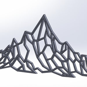 May include: A geometric mountain range wall decor made of metal. The design is a stylised representation of a mountain range with a jagged, crystalline appearance.