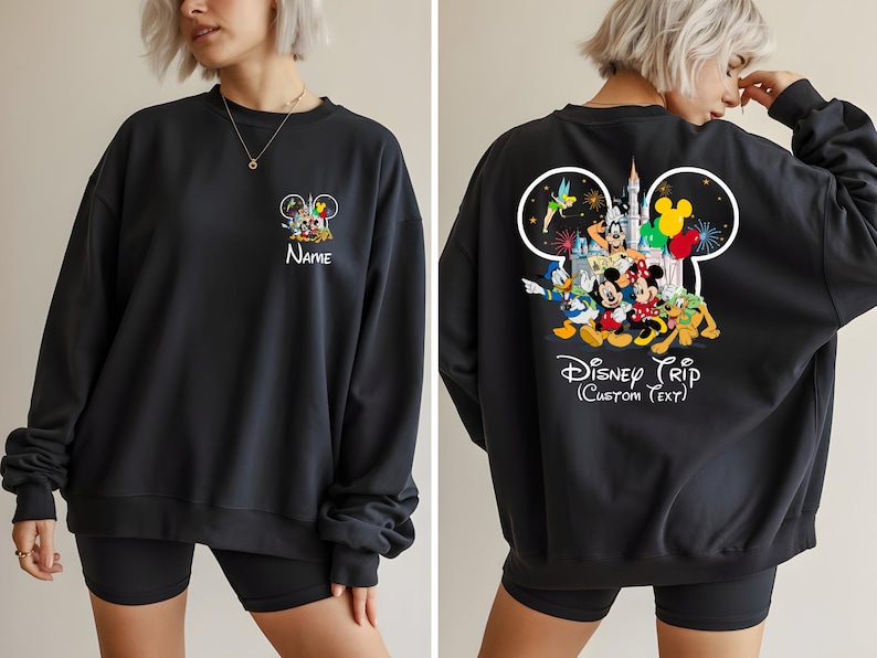 May include: Black sweatshirt featuring a Disney theme. The front displays a Mickey Mouse graphic with the name "Name". The back showcases a larger Disney character design with the text "Disney Trip (Custom Text)".