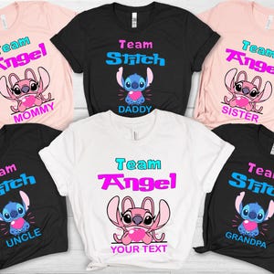 May include: A collection of t-shirts featuring the characters Angel and Stitch. The shirts are in various colors, including pink, black, and white, with the words "Team Angel" and "Team Stitch" in a colorful font. Each shirt has a different family member's name.